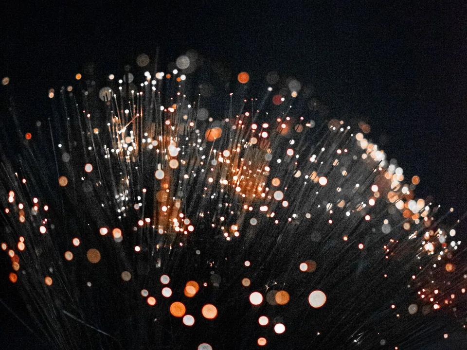Close view of illuminated orange technical fibres